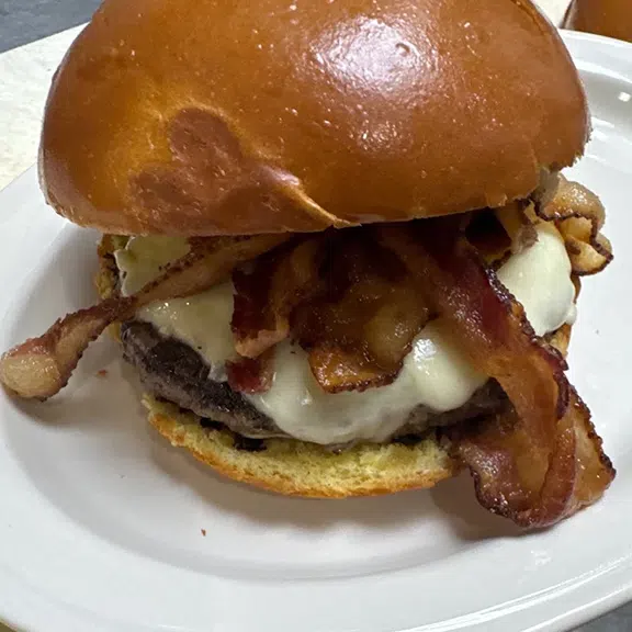 Juicy bacon cheeseburger served on a toasted brioche bun